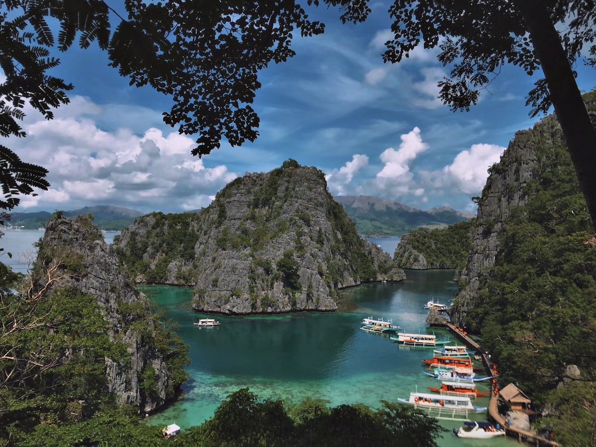 Palawan October — green lake surrounded by karst mountains at Coron as the monsoon begins to ease
