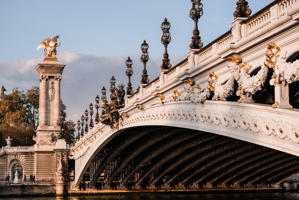 brown concrete bridge under blue sky during daytime