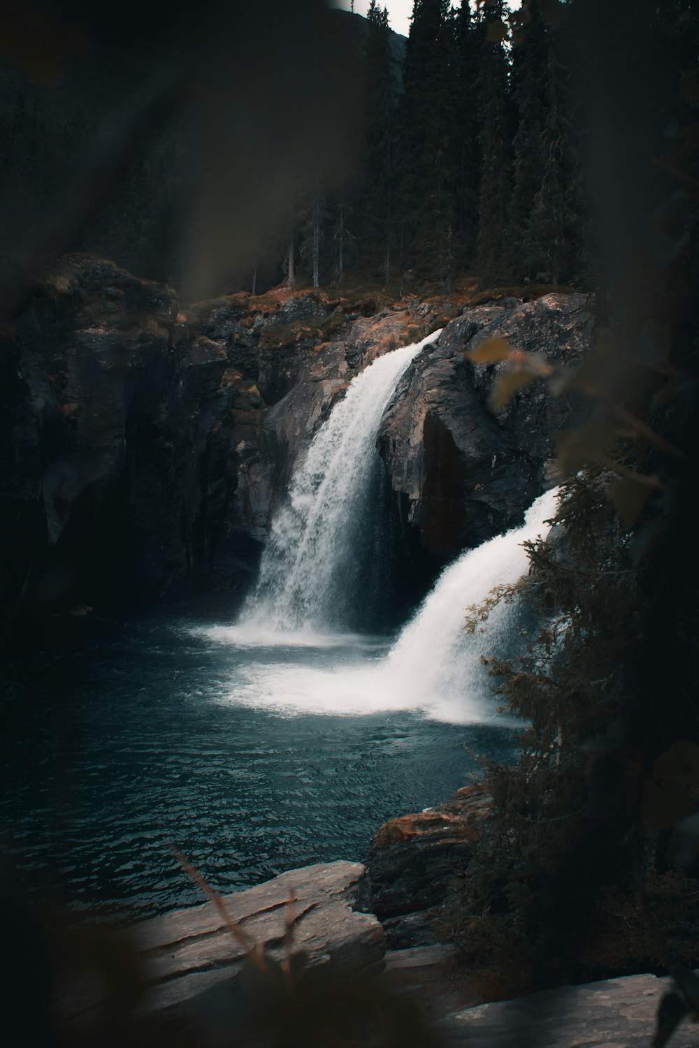 waterfalls in the middle of the forest