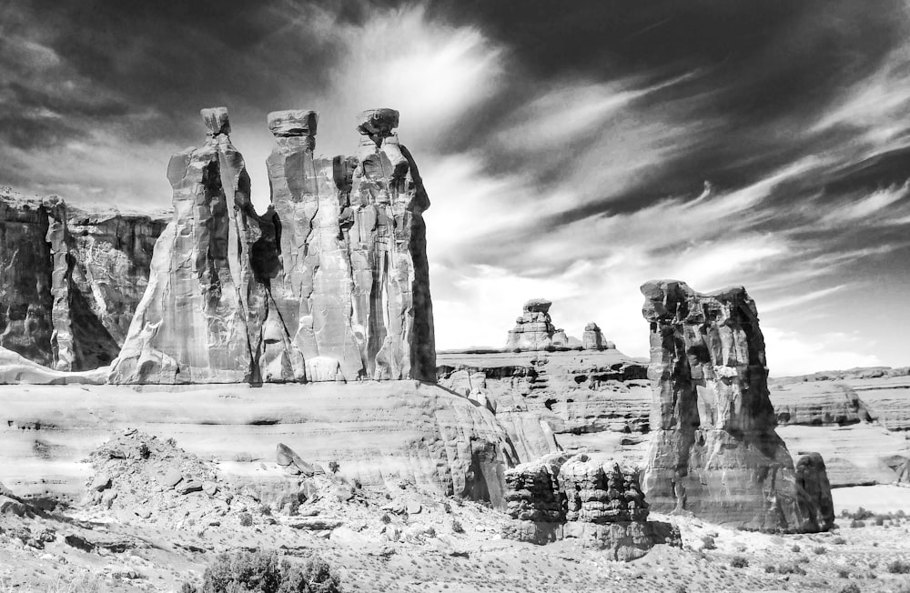 grayscale photo of man and woman statue