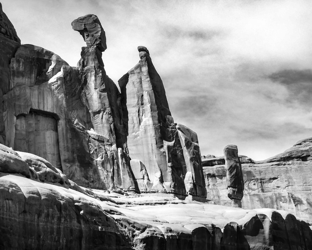 grayscale photo of rock formation