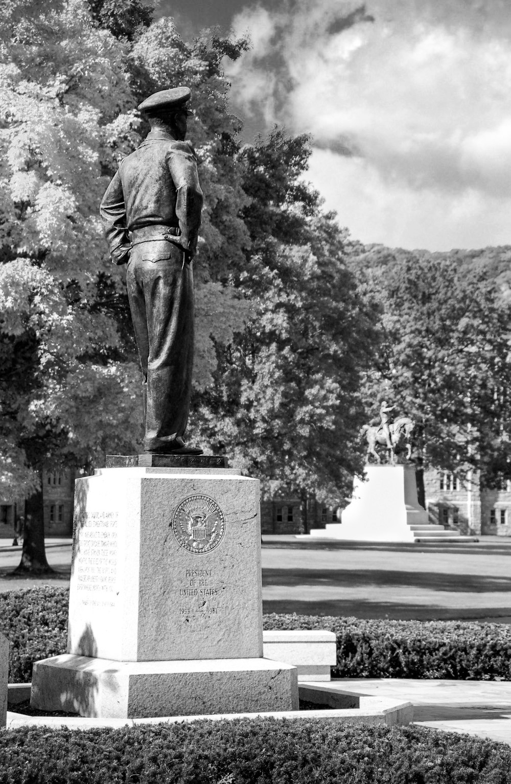 grayscale photo of man statue