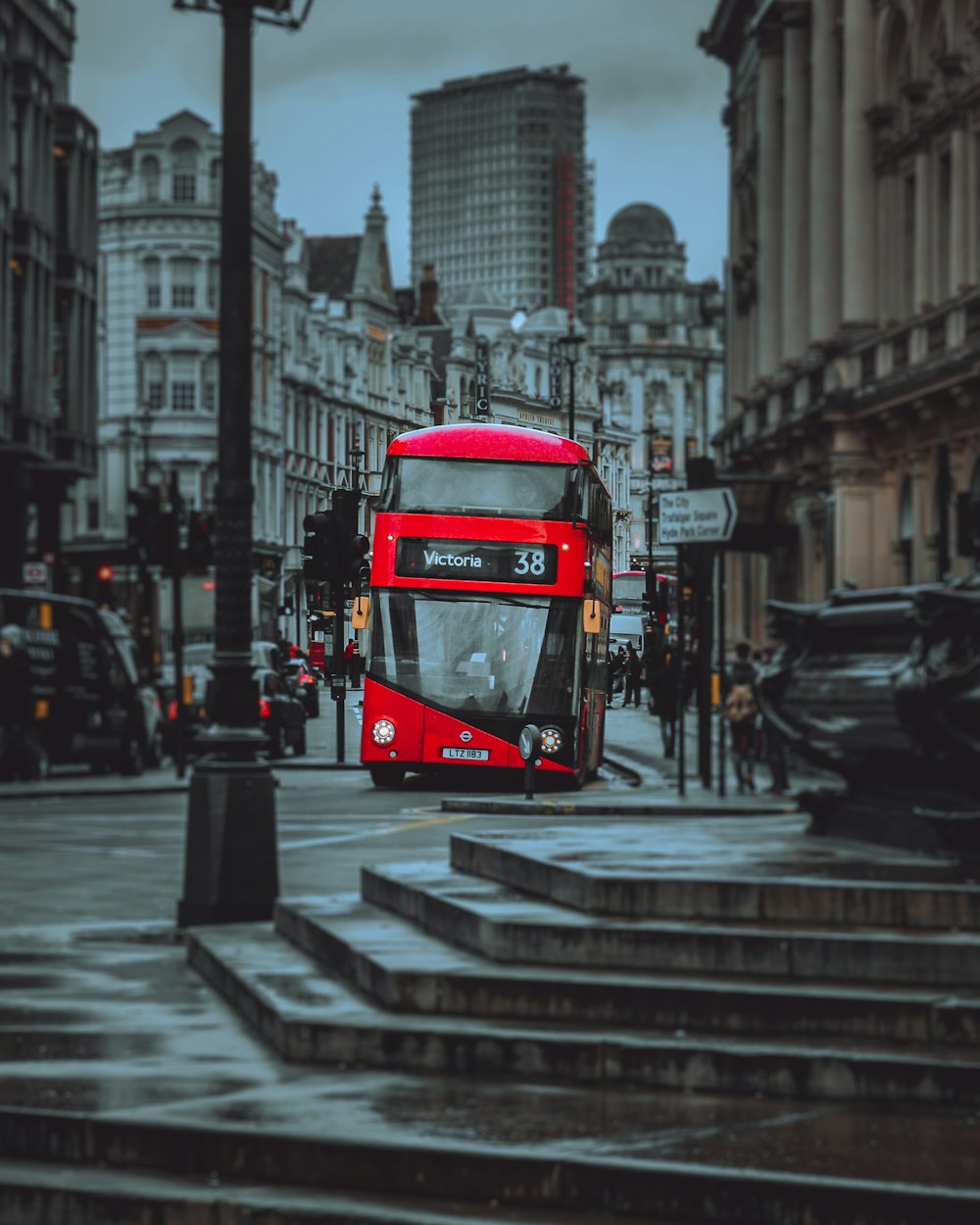 red and black tram on the city during daytime