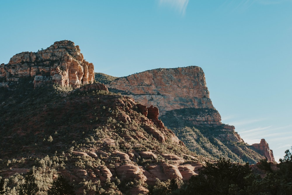 brown rocky mountain under blue sky during daytime