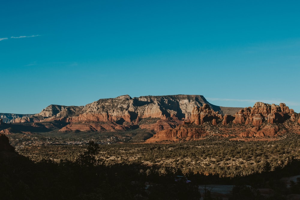 brown mountain under blue sky during daytime