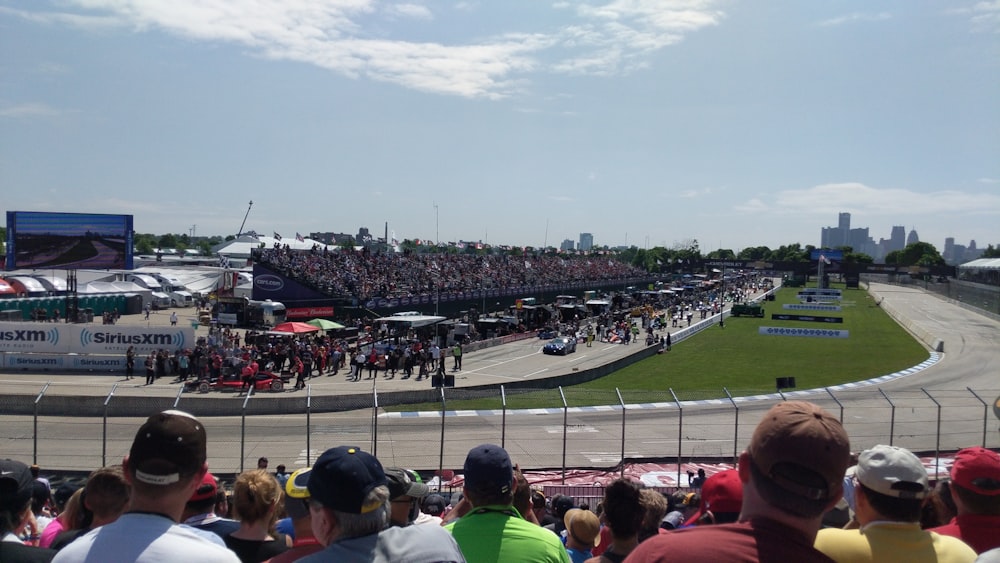 people watching football game during daytime