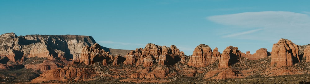 brown rock formation under blue sky during daytime