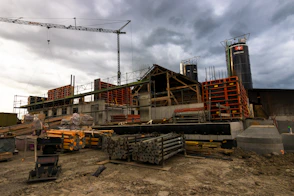 a construction site with a crane in the background