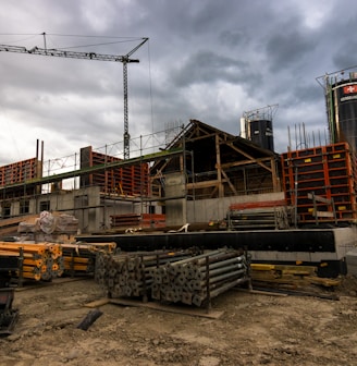 a construction site with a crane in the background