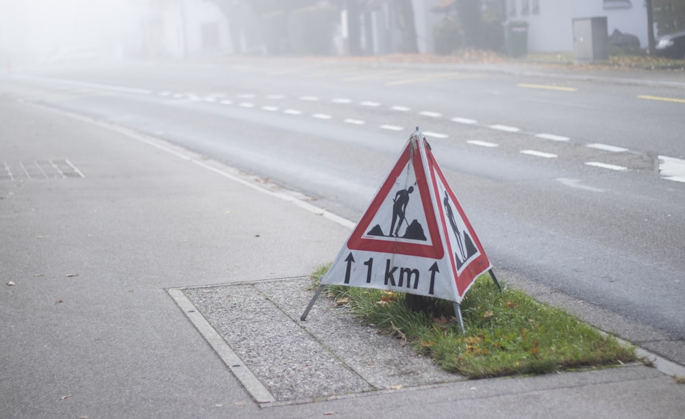 white and black x road sign