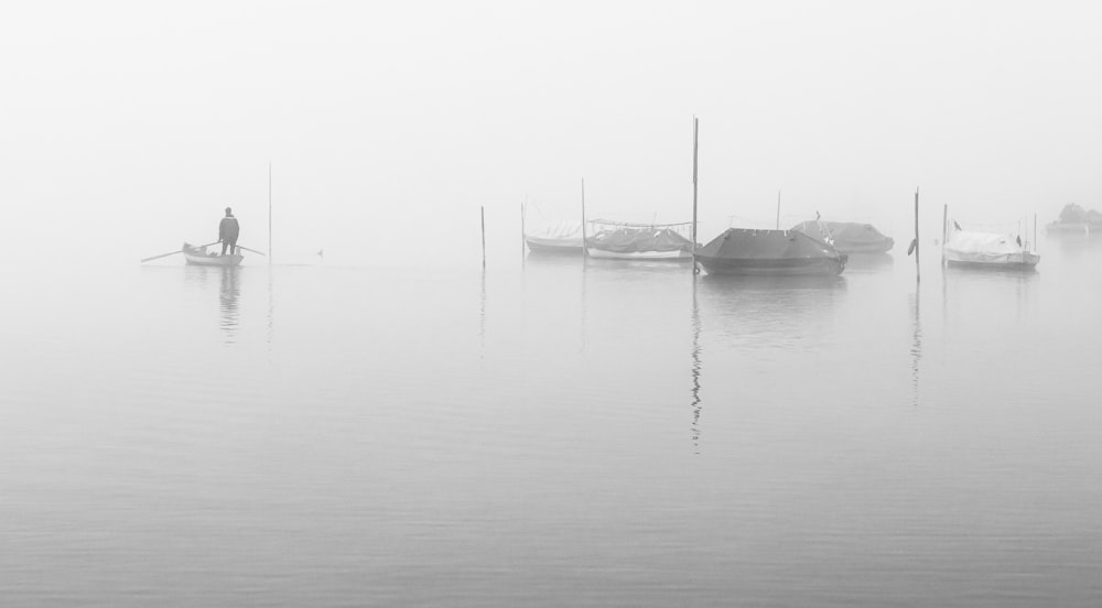 grayscale photo of boat on body of water