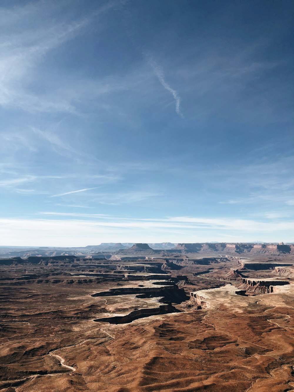 brown mountains under blue sky during daytime