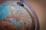 blue and white globe with blue plastic frame