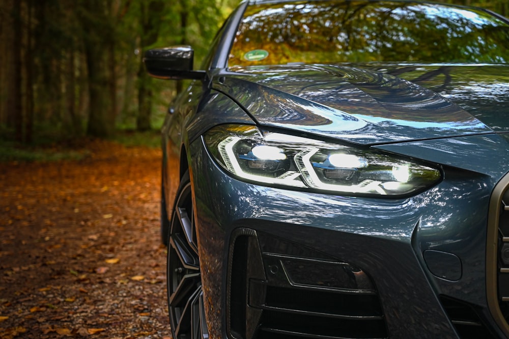 black mercedes benz car on brown dirt road during daytime