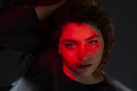 A dramatic still from a brand film featuring dynamic lighting and expressive actors.