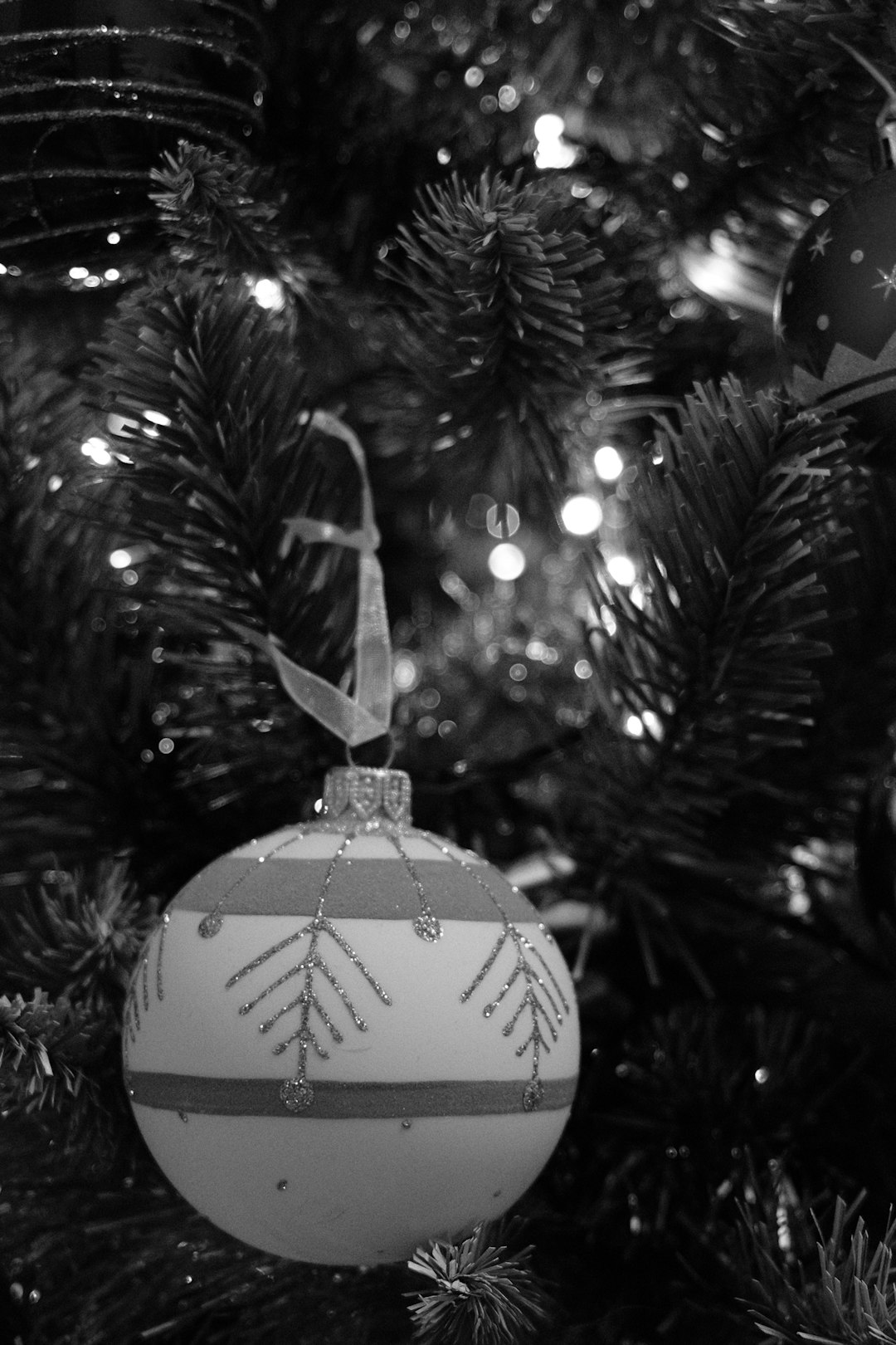 white christmas bauble on christmas tree