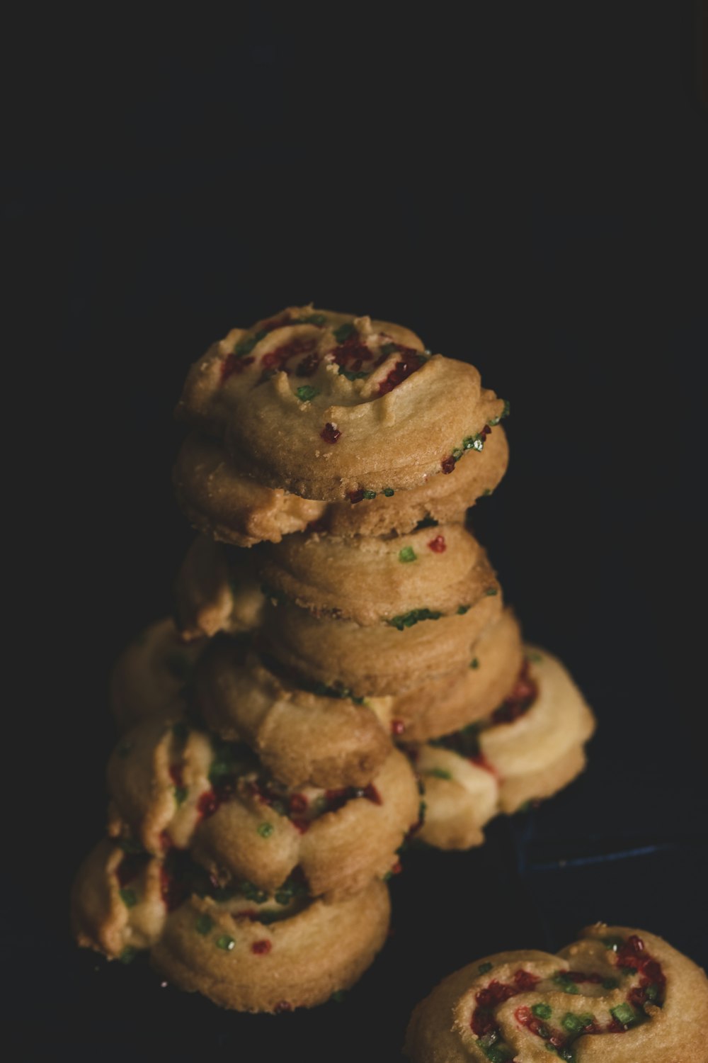 brown cookies on black surface