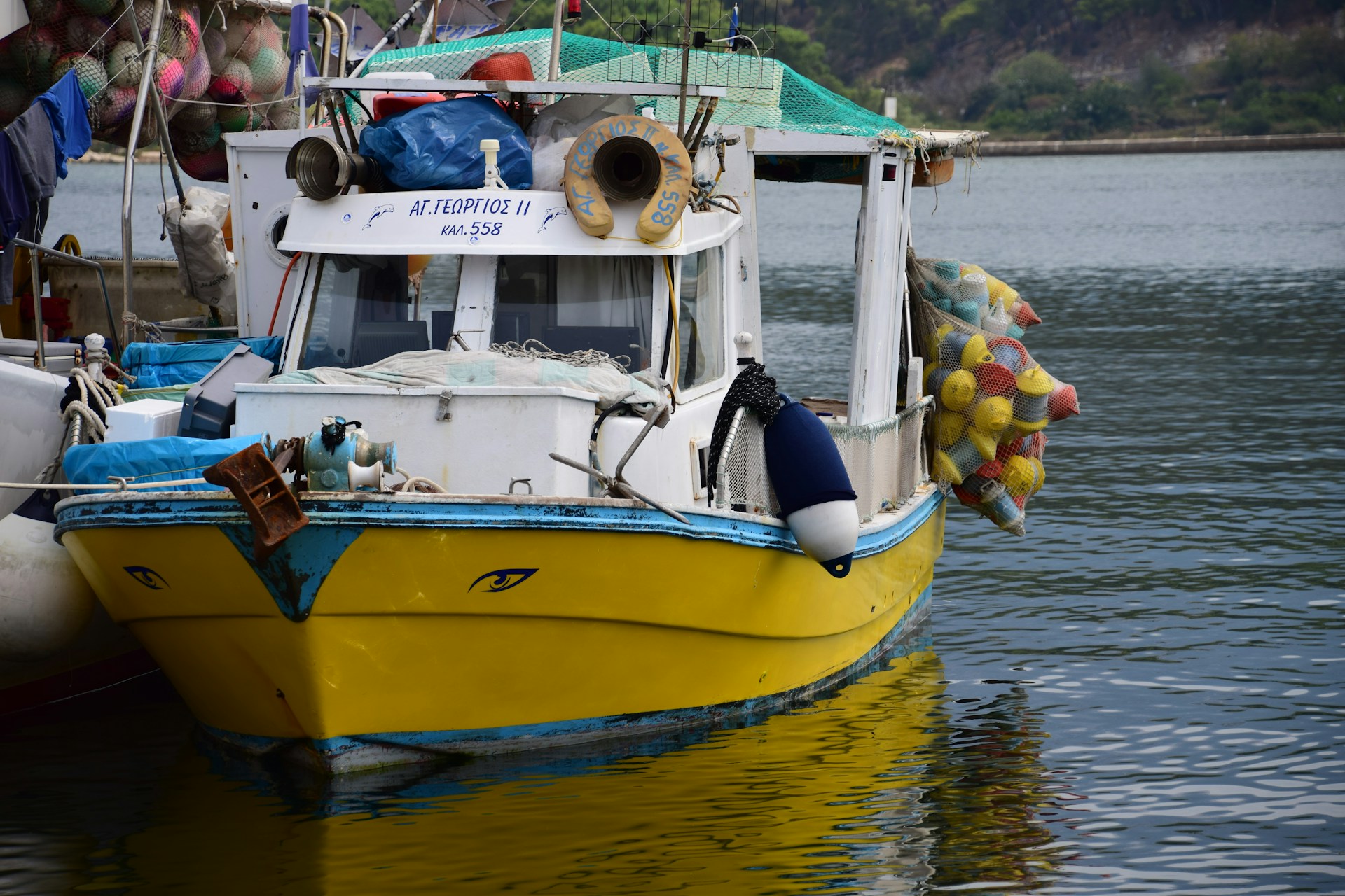 A colorful shot of a bass boat docked at Norfolk Marine Service, with sunlight reflecting off its polished hull and fishing gear neatly arranged.