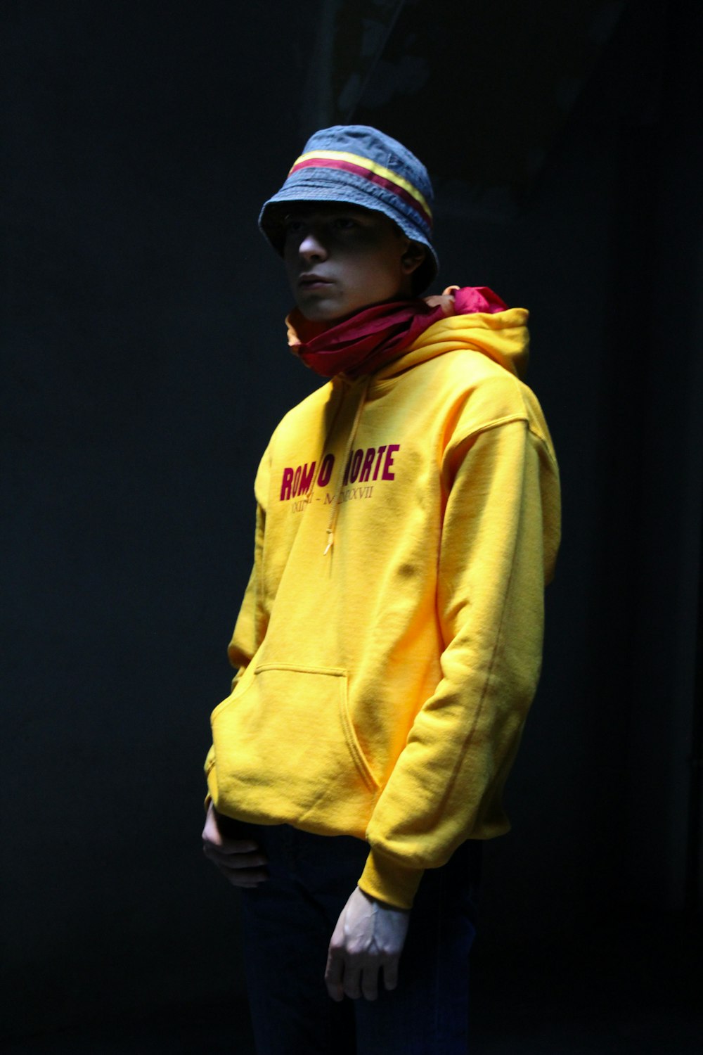 man in yellow hoodie standing