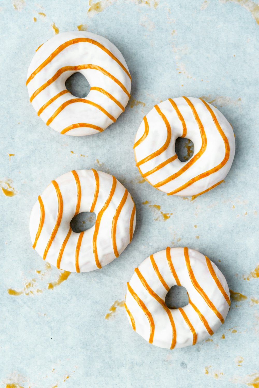 white and brown donuts on white surface