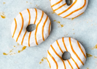 white and brown donuts on white surface