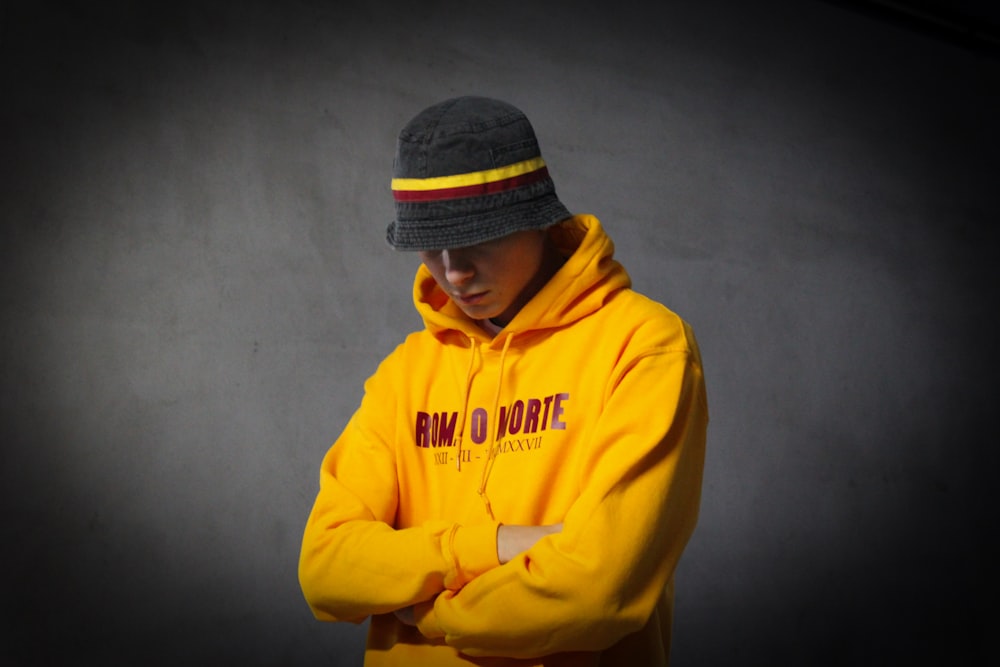 man in yellow and gray hoodie