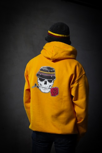 person in yellow and black hoodie