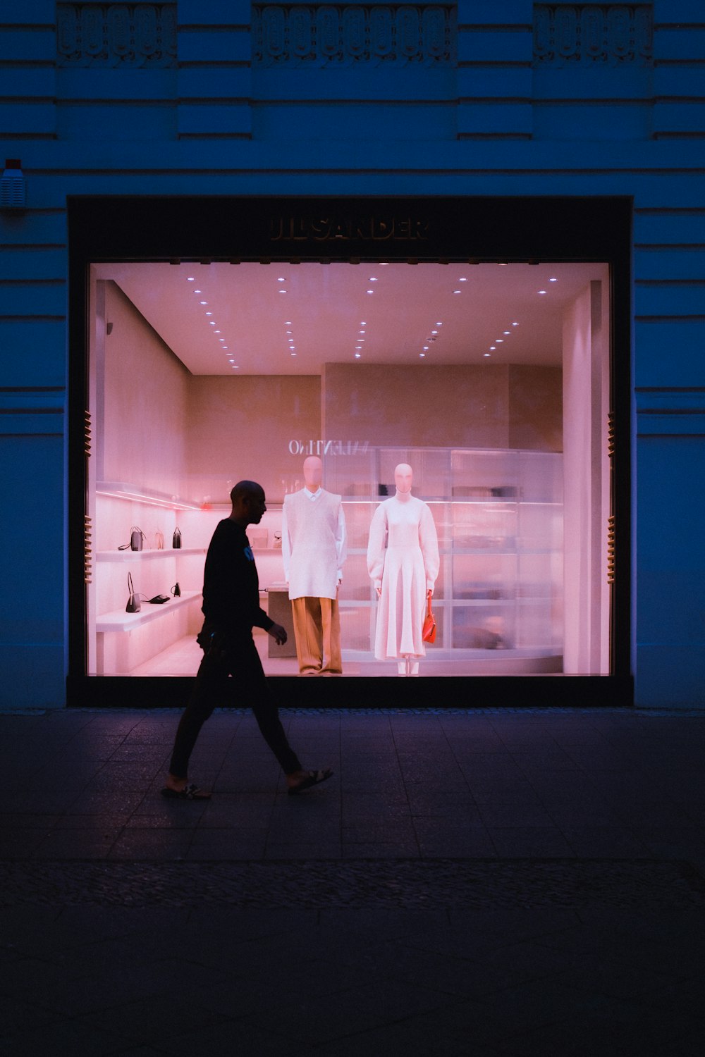 man and woman walking on hallway