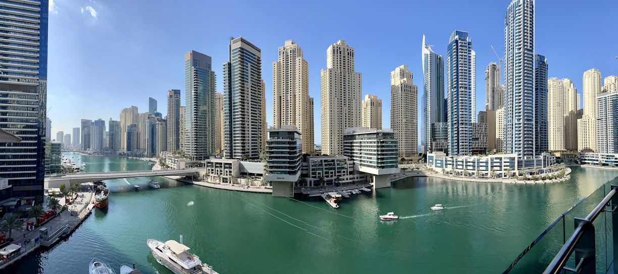 high rise buildings near body of water during daytime