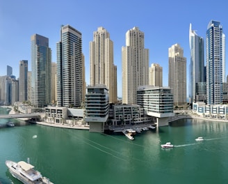 high rise buildings near body of water during daytime