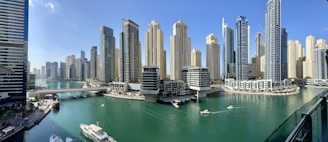high rise buildings near body of water during daytime