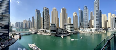 high rise buildings near body of water during daytime