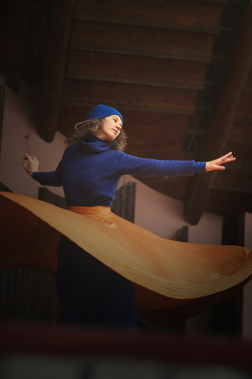 woman in blue long sleeve shirt and yellow pants