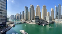 high rise buildings near body of water during daytime