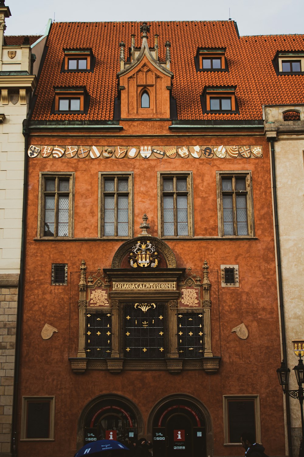 brown brick building with black metal window