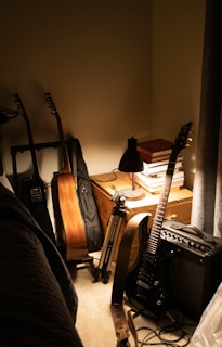 Evening shot of a quiet room with guitar and keyboard ready for the next creative session