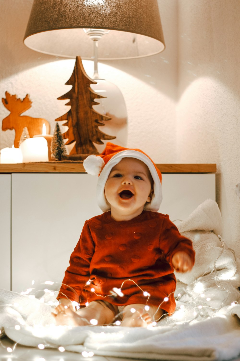 baby doll in red long sleeve shirt