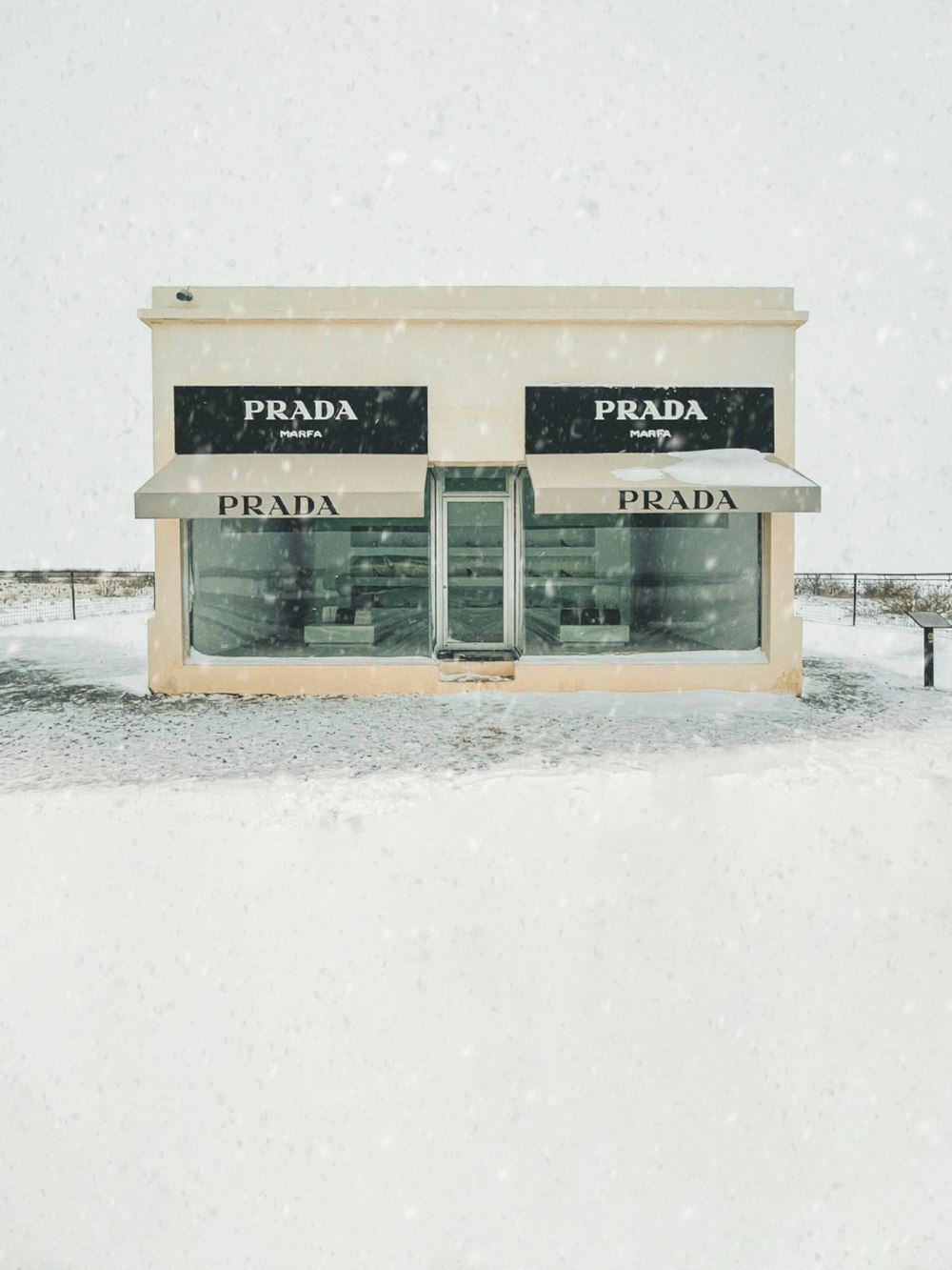 white wooden signage on white snow