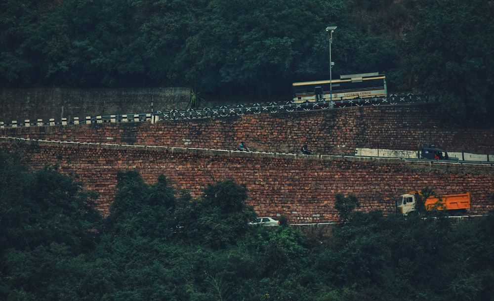 brown brick building near green trees during daytime