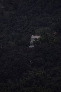 white concrete building on top of mountain