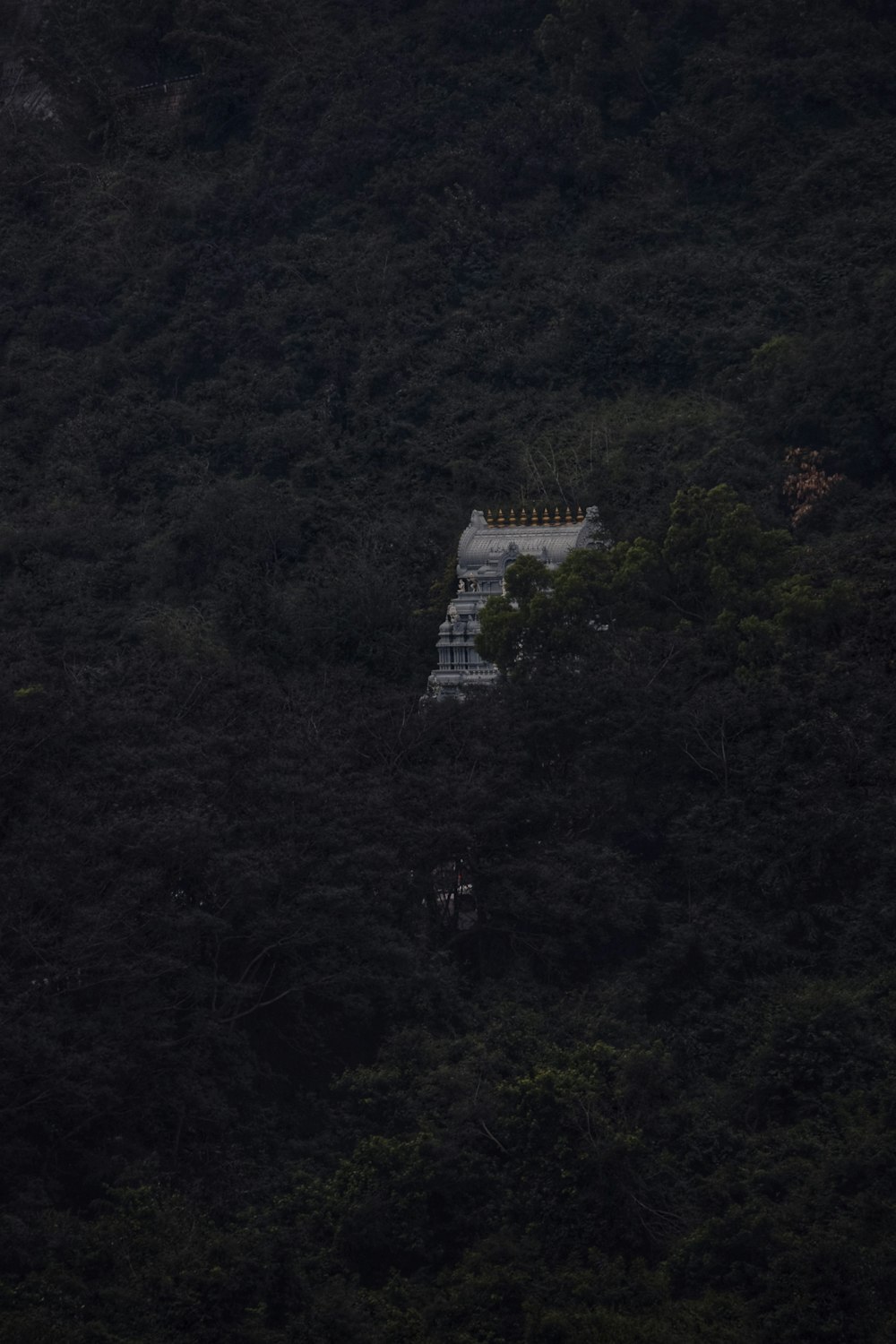 white concrete building on top of mountain