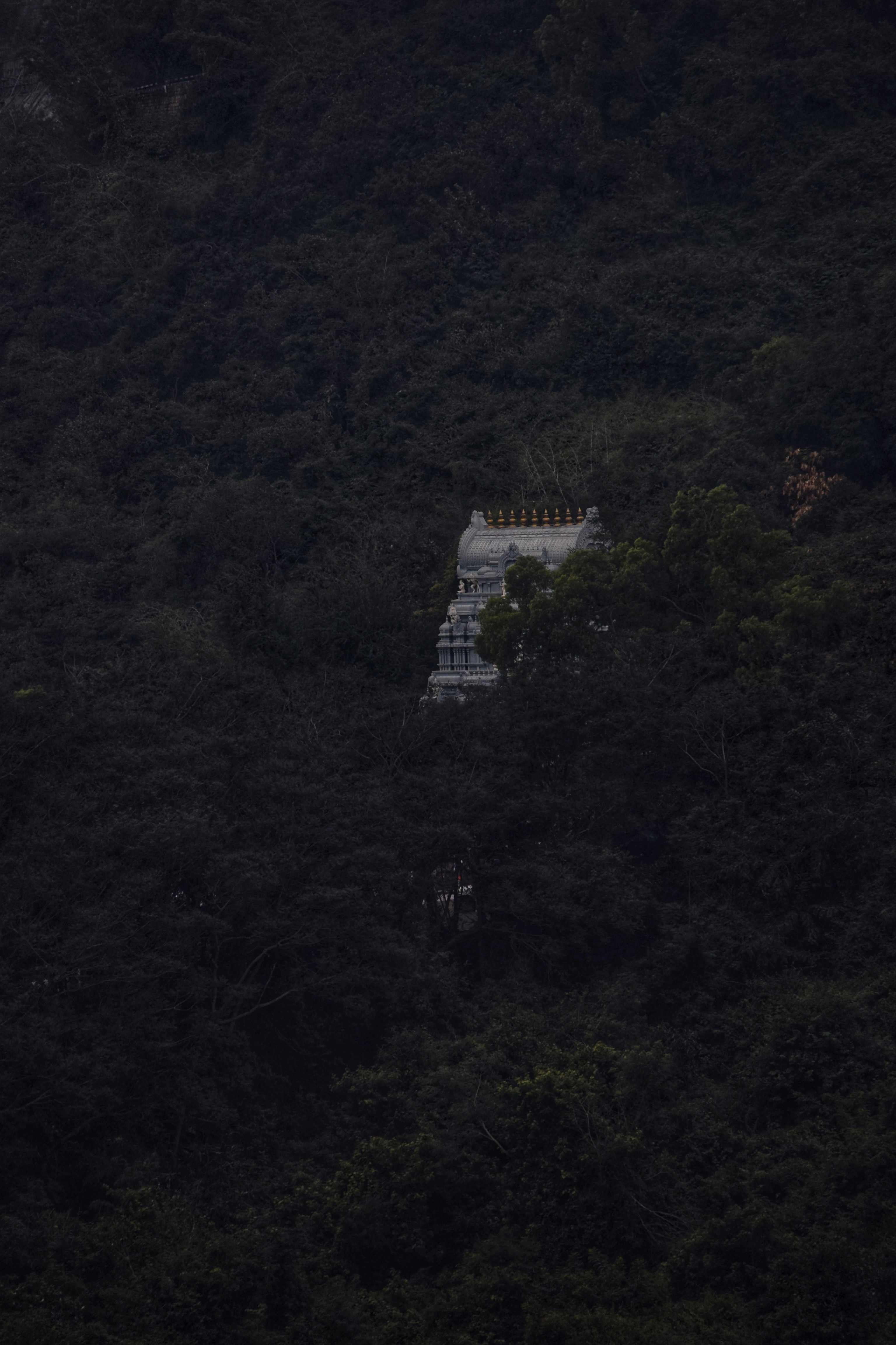 white concrete building on top of mountain