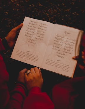 person holding white printer paper