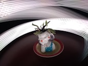 A small ceramic figurine of a girl with a serene expression is placed on a circular red and beige base. The figurine has purple hair, closed eyes, and red cheeks, and is wearing a blue dress with white polka dots. There are green leaves sprouting from the top of the figurine's head. The background features dynamic light trails creating a sense of movement and energy.