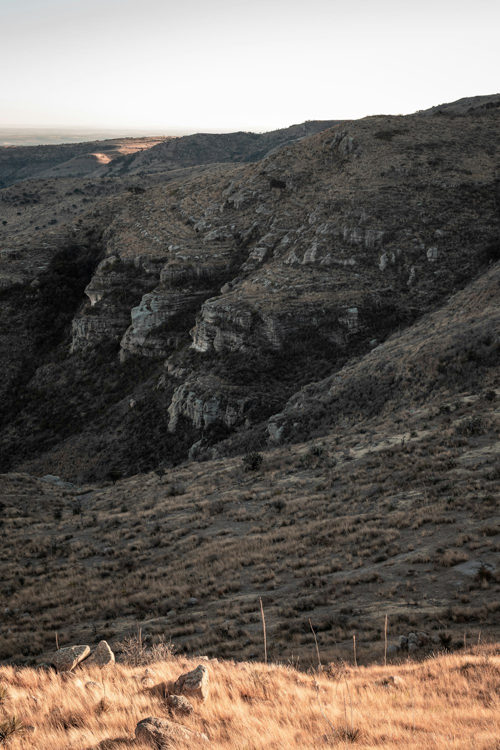 brown and green mountain under white sky during daytime