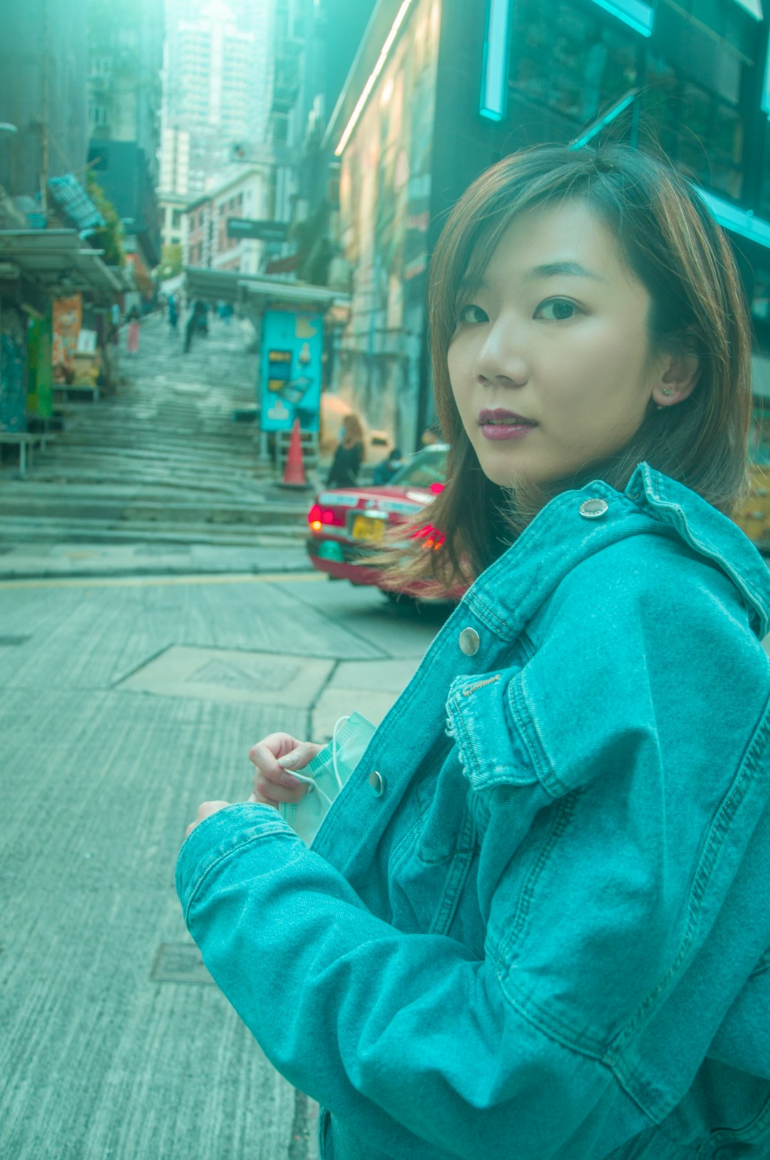 girl in blue denim jacket smiling