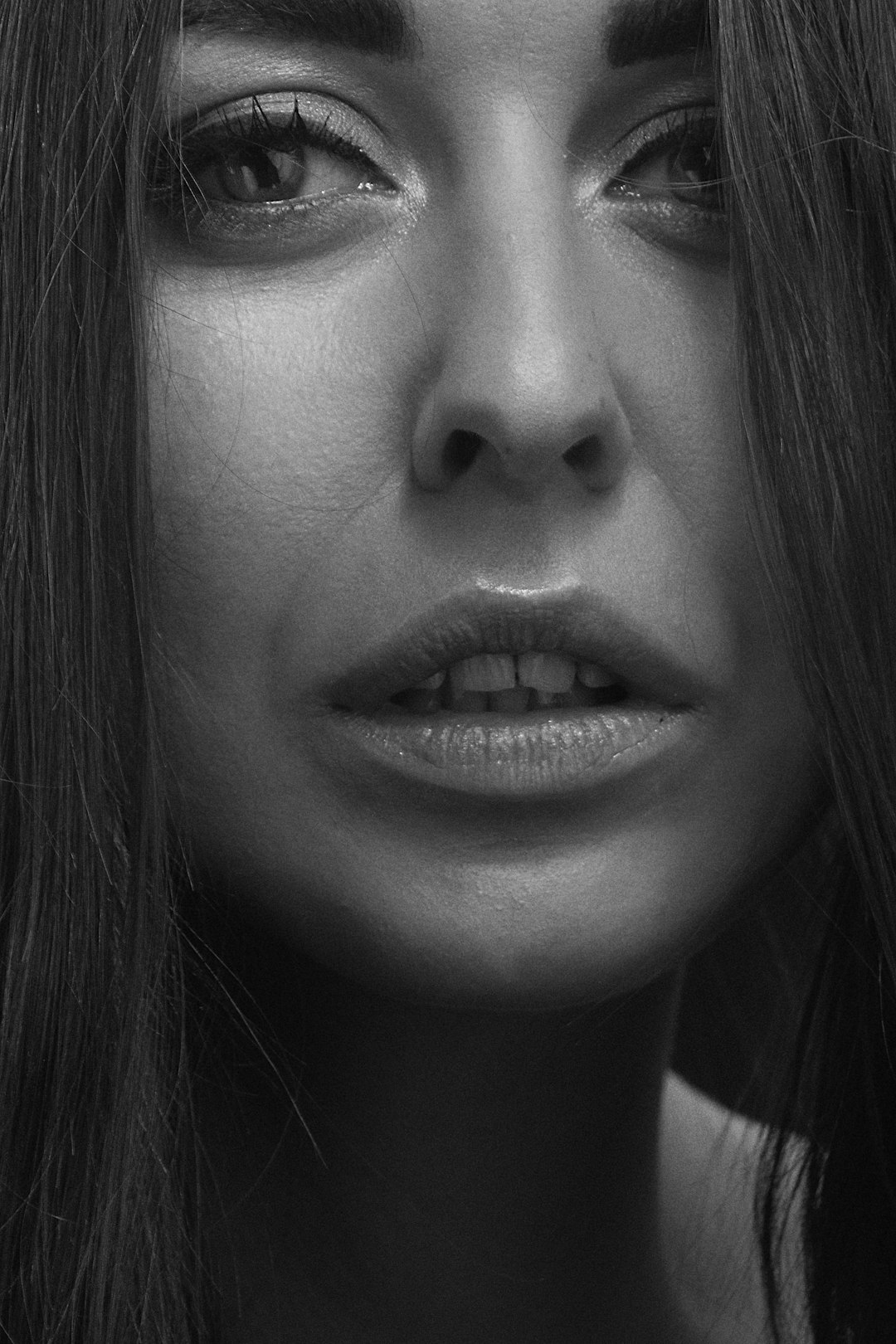 grayscale photo of womans face