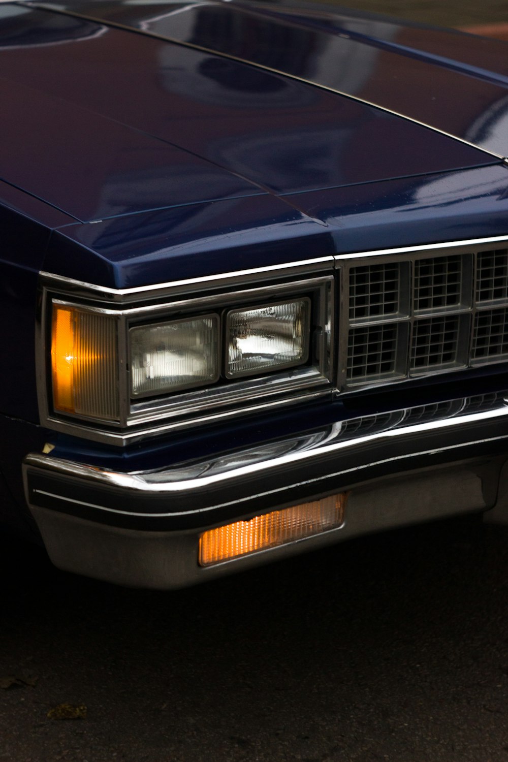 blue and silver car in close up photography