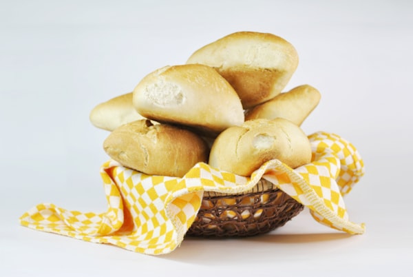 Basket of golden cheese bread rolls