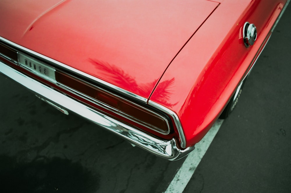 red car on gray asphalt road